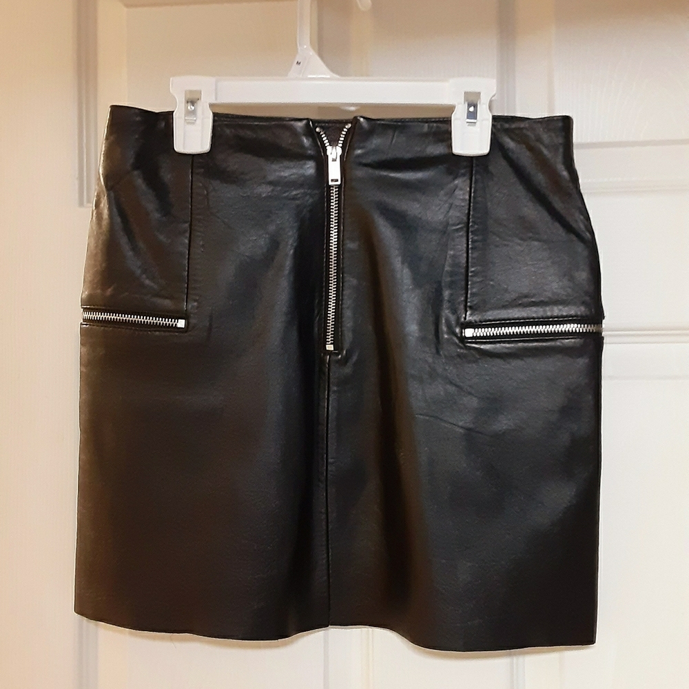 Faux leather mini skirt with silver zippers.